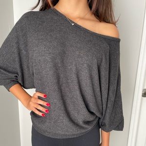 Charcoal color off the shoulder top. Stretchy